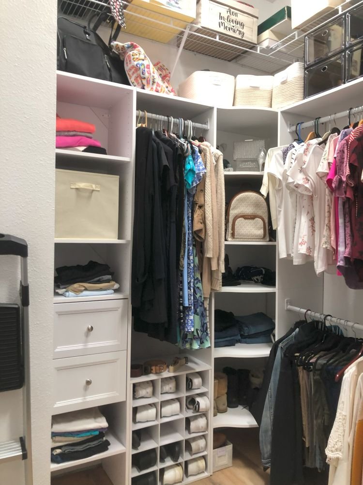 Left-side view of an organized closet featuring folded clothes, cubby shoe storage, and categorized hanging items—demonstrating how to declutter your wardrobe.